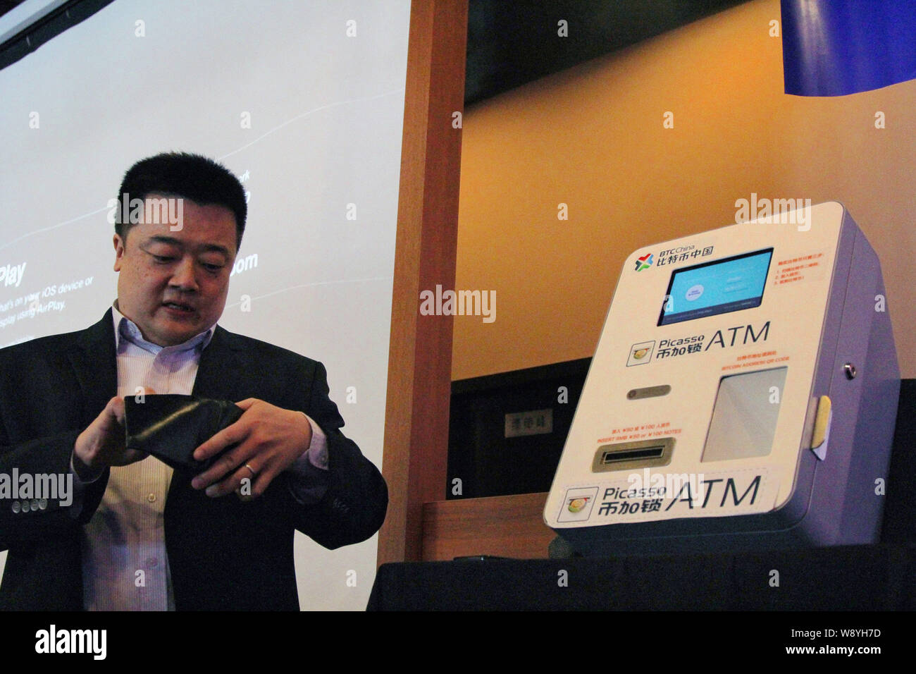 Bobby Lee, CEO of BTC China, demonstrates the operation of Chinas first  BitCoin ATM at a launch event in Shanghai, China, 15 April 2014. A Chinese  c Stock Photo - Alamy