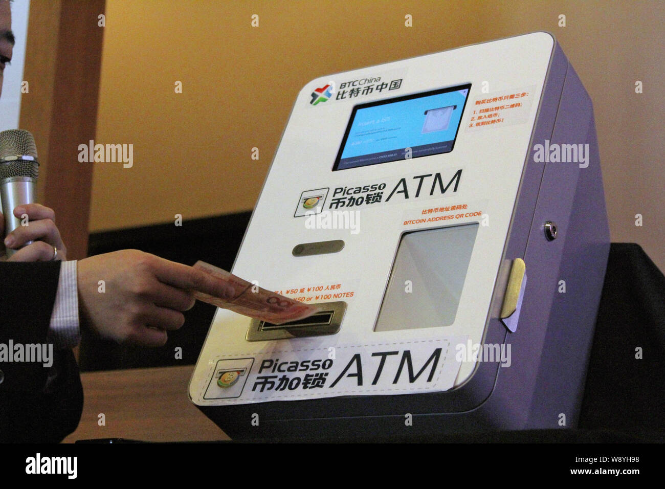 Bobby Lee, CEO of BTC China, demonstrates the operation of Chinas first  BitCoin ATM at a launch event in Shanghai, China, 15 April 2014. A Chinese  c Stock Photo - Alamy