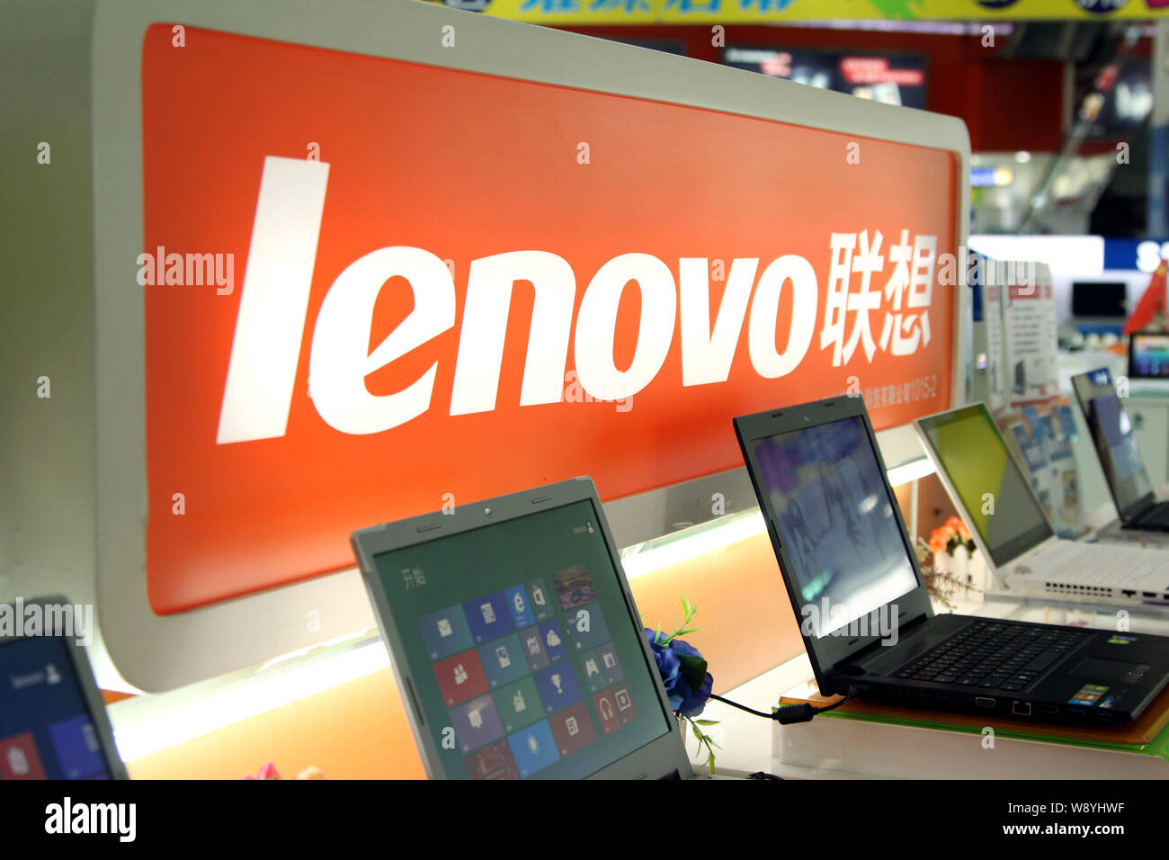 --FILE--Laptop computers of Lenovo are for sale at a store in Shanghai, China, 22 January 2014.   A decade after Lenovo Group Ltd. bought Internationa Stock Photo