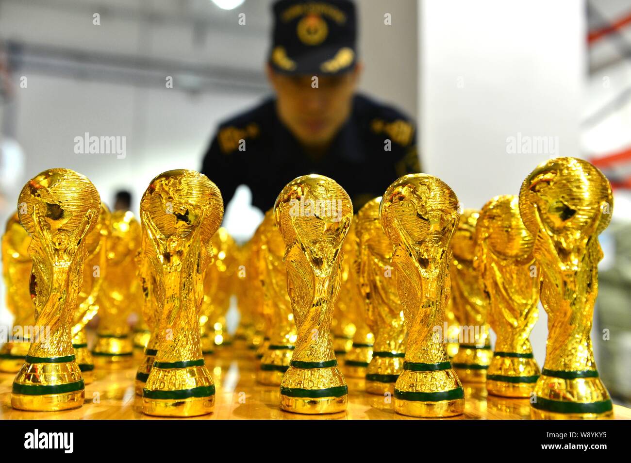 A Chinese Customs Officer Checks Seized Fake World Cup Trophies At A Warehouse In Yiwu City East Chinas Zhejiang Province 24 April 14 18 860 Fa Stock Photo Alamy