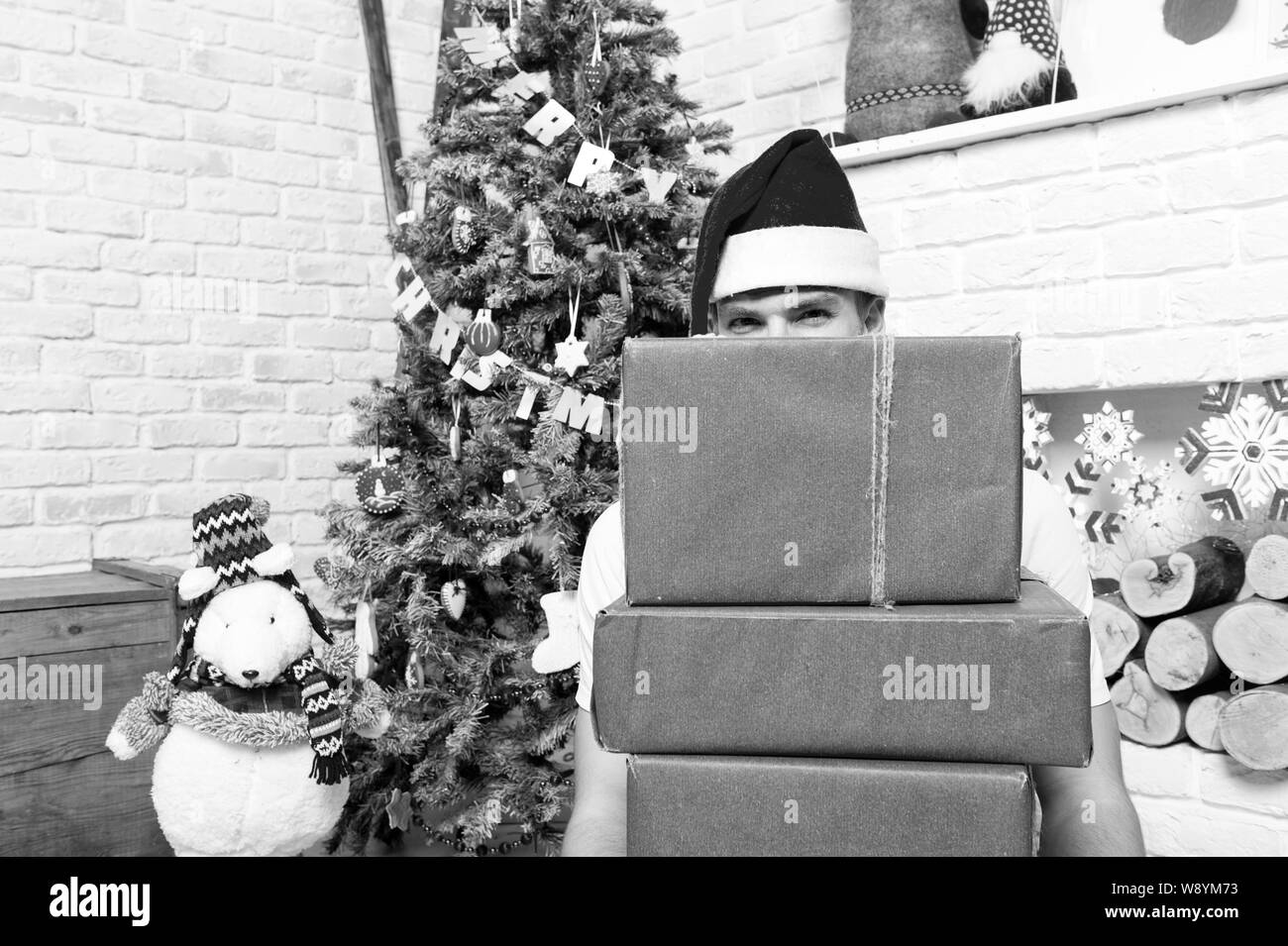 Holidays preparation and celebration. Man santa with boxes at christmas