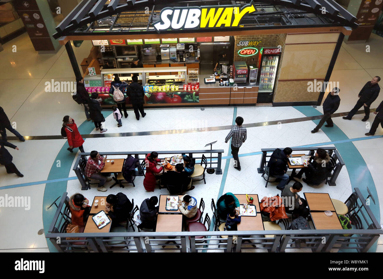 --FILE--Customers shop at a branch of Subway fast food store in Beijing, China, 2 December 2011.   Fast food chain Subway China claimed on Sunday (9 F Stock Photo