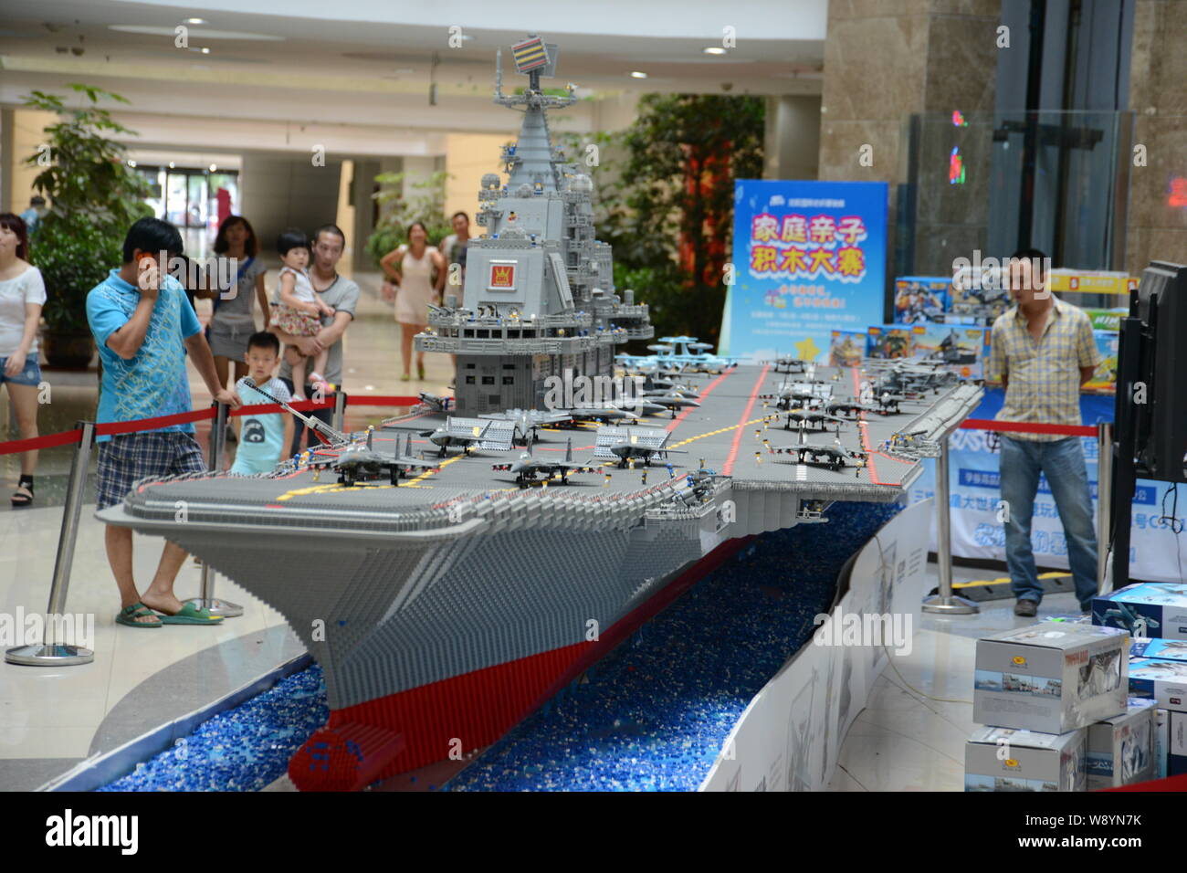 Visitors look at a model of the Liaoning Aircraft Carrier made from Lego  bricks at a shopping mall in Shenyang city, northeast Chinas Liaoning  provinc Stock Photo - Alamy