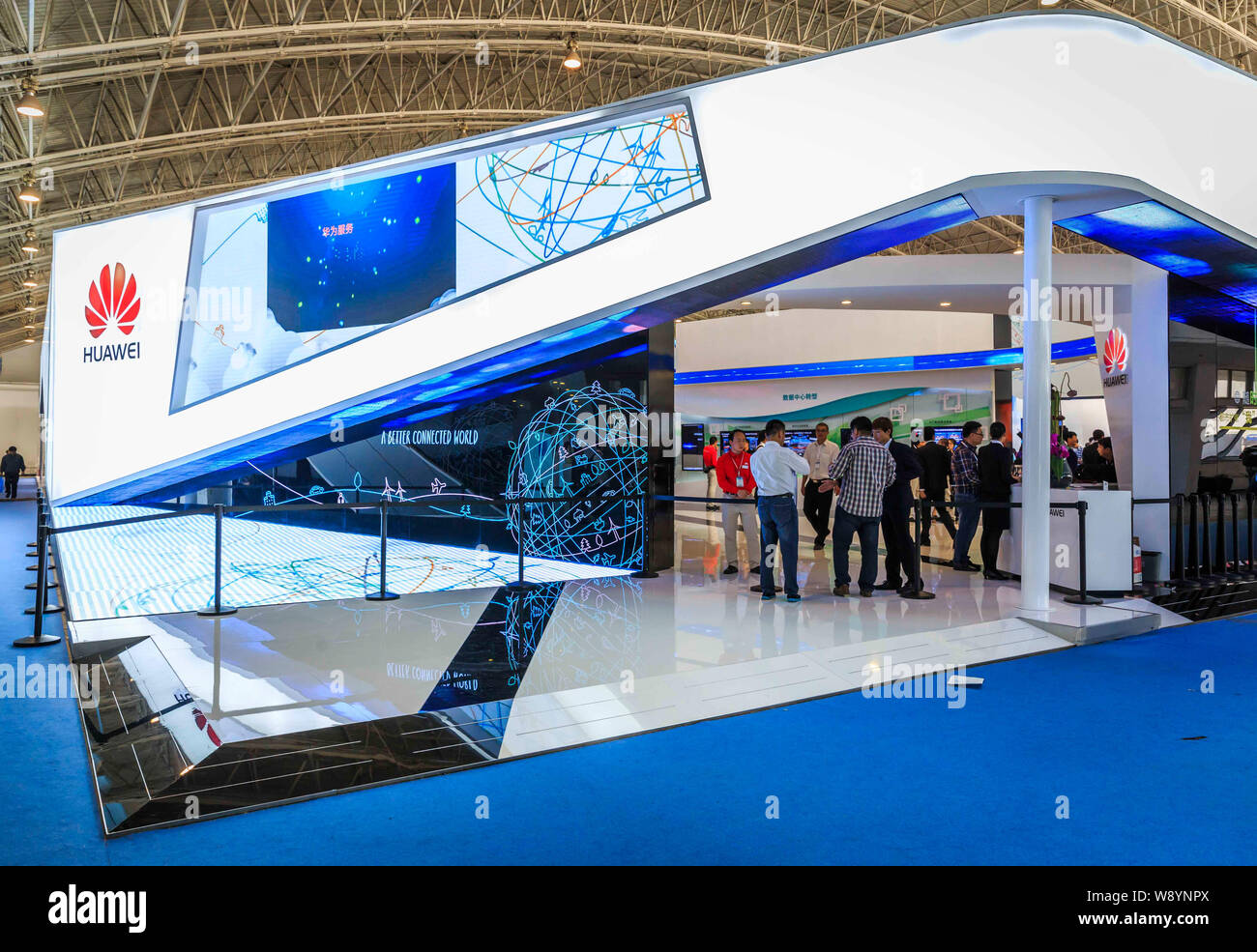 FILE--People visit the stand of Huawei during the PT/EXPO COMM China 2014  in Beijing, China, 27 September 2014. Huawei strives to be an industry  Stock Photo - Alamy