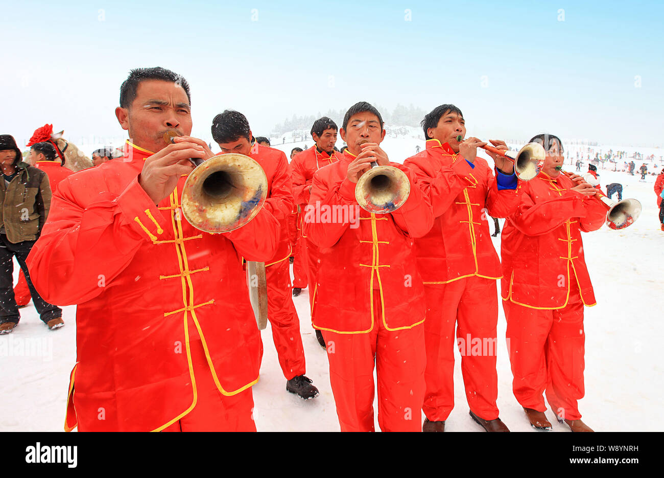 Entertainers play the suona, a Chinese shawm, during a traditional