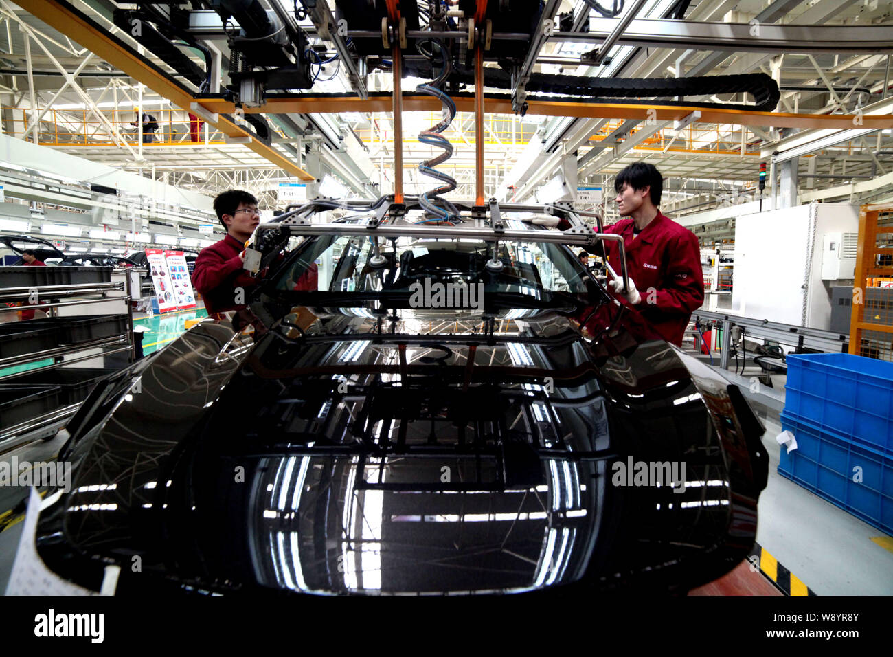 --FILE--Chinese workers assemble cars on the assembly line at the auto ...