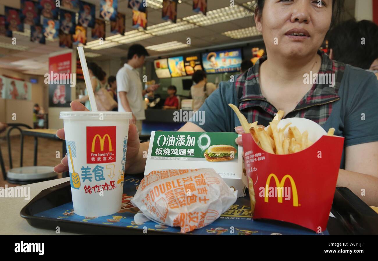 FILEA customer eats at a McDonalds fastfood restaurant in Beijing