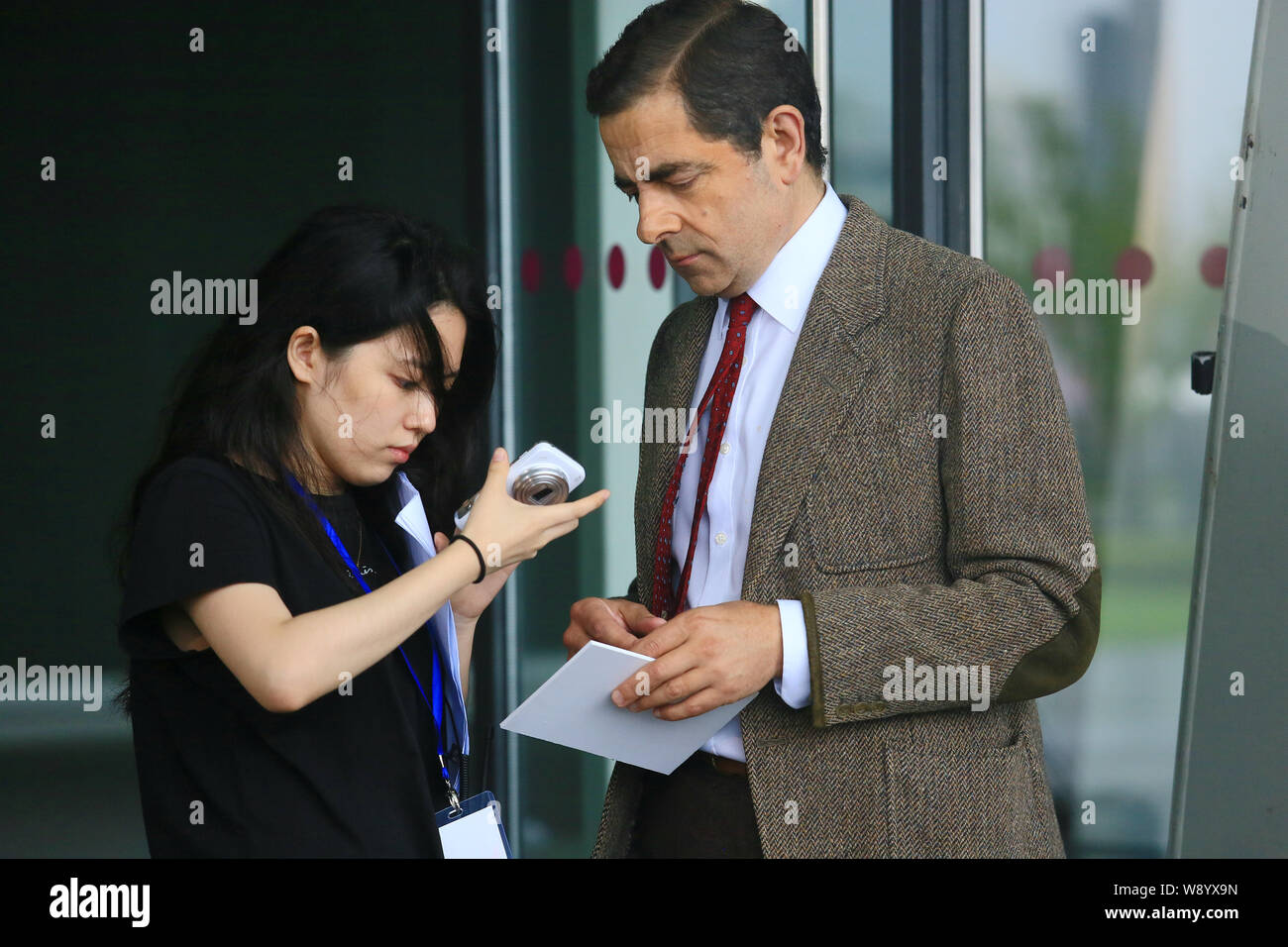 English Actor Rowan Atkinson Right Plays Mr Bean During A - 