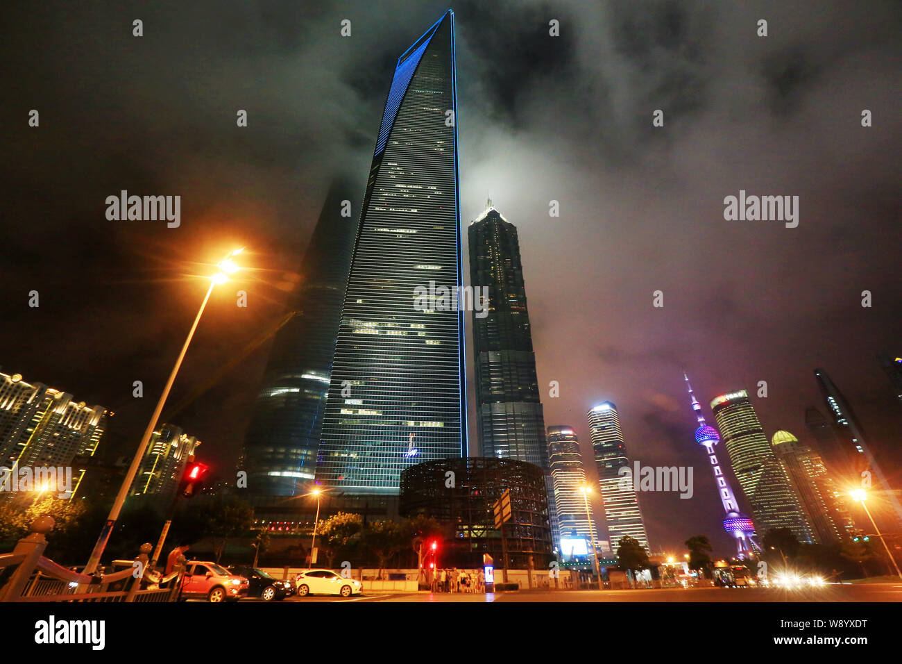 Night view of the Shanghai Tower under construction, tallest left, the Shanghai World Financial Center (SWFC), tallest center, the Jinmao Tower, talle Stock Photo