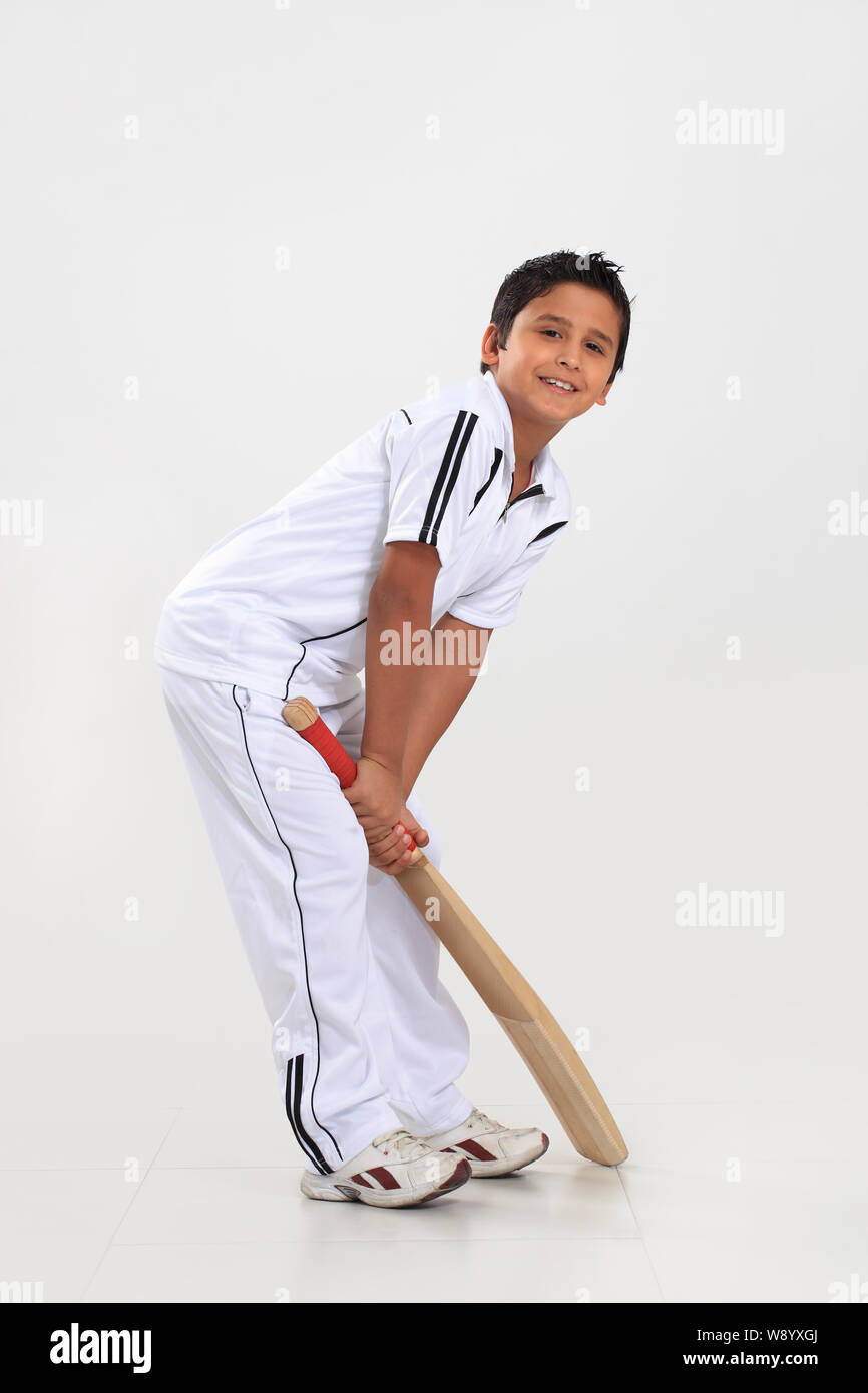 Boy playing cricket Stock Photo Alamy
