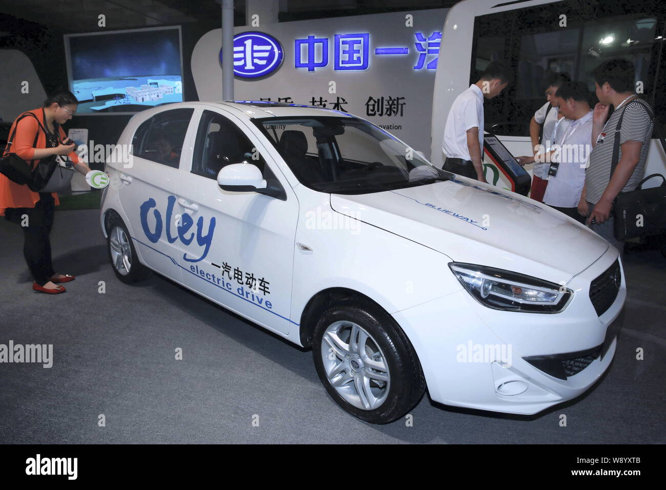 FILEVisitors look at an Oley electric car of FAW Group during an