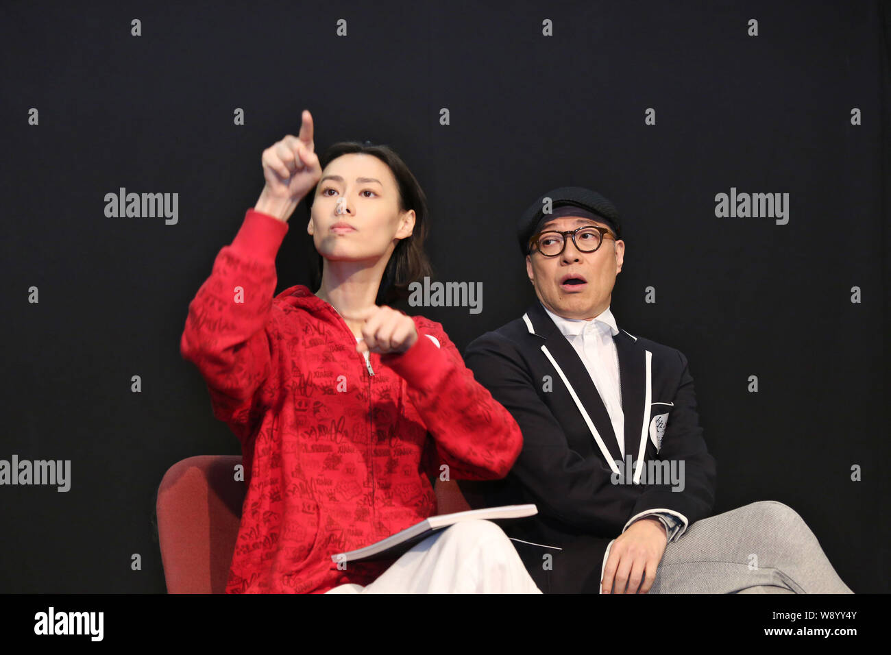 Hong Kong actress Isabella Leong, left, and Hong Kong actor Jim Chim perform during a rehearsal for their theatre drama, Sign of Happiness, in Hong Ko Stock Photo