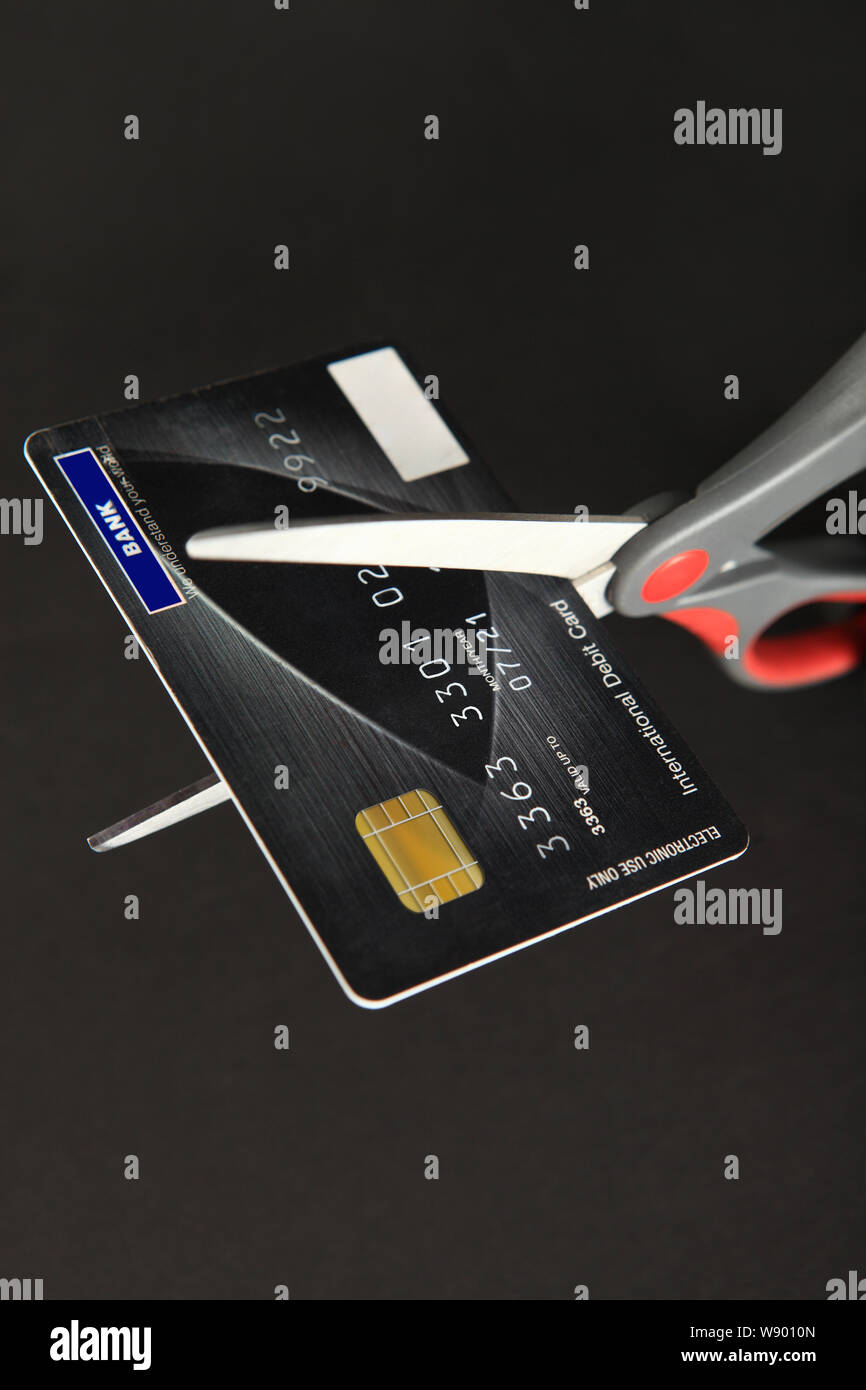 Scissors Cutting Credit Card Stock Photo
