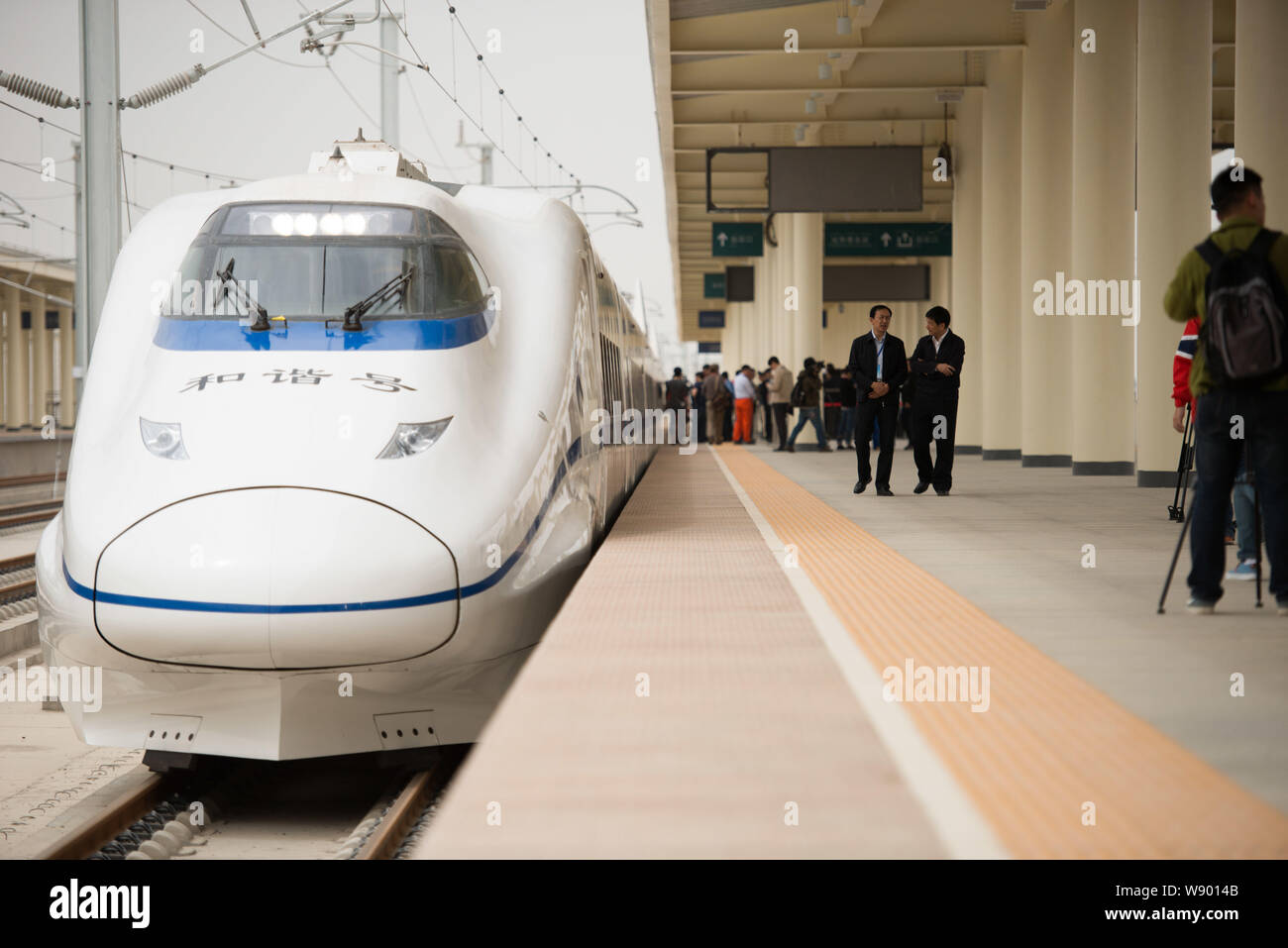 A CRH (China Railway High-speed) train is seen at the Turpan (Tulufan) North Railway Station after completing the first half of a system integration t Stock Photo