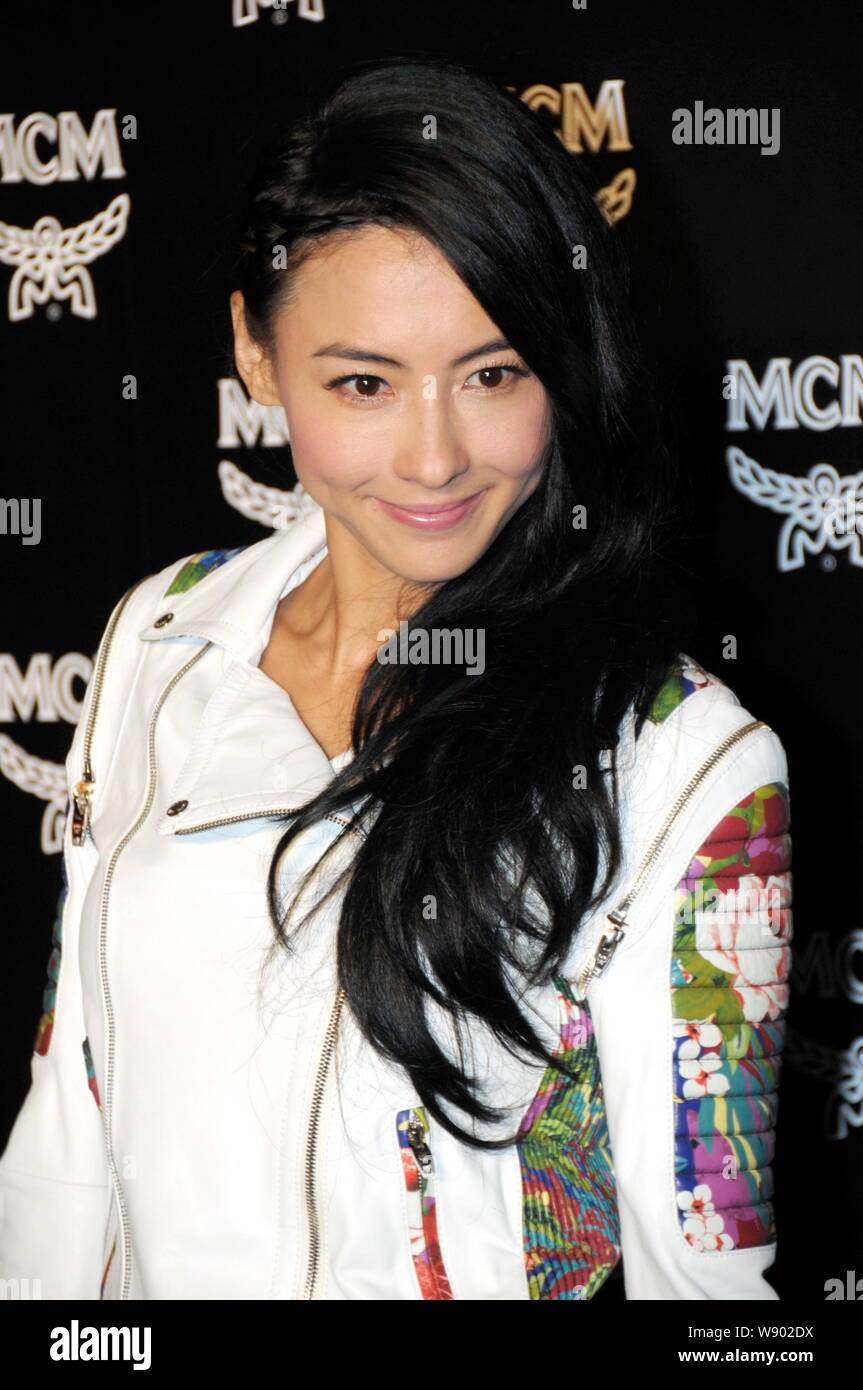 Hong Kong singer and actress Cecilia Cheung poses as she arrives at the opening ceremony for the flagship store of luxury fashion brand MCM in Shangha Stock Photo