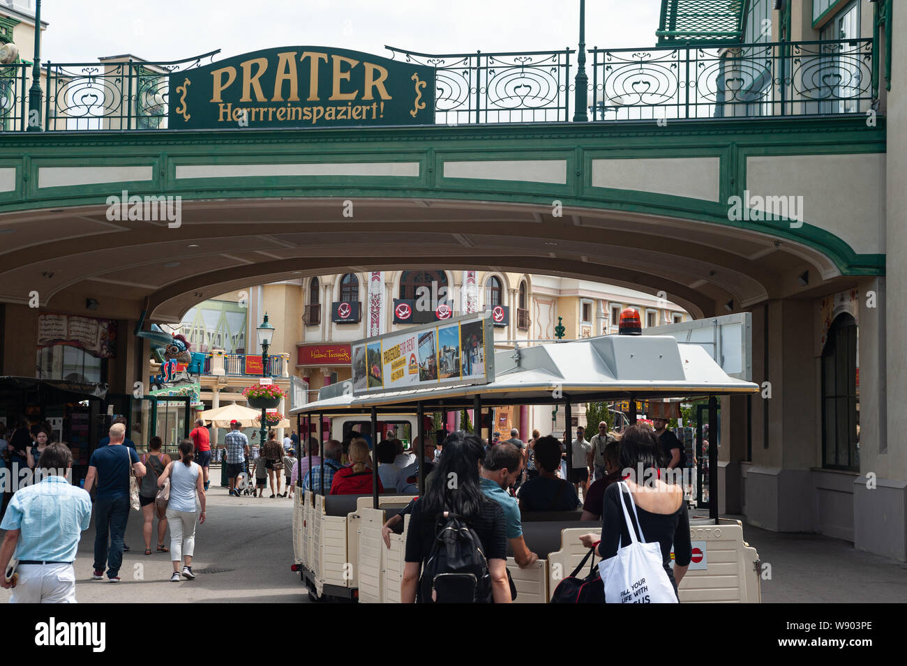 16.06.2019, Vienna, Austria, Europe - Visitors walk through the entrance at the Wiener Prater amusement park. Stock Photo