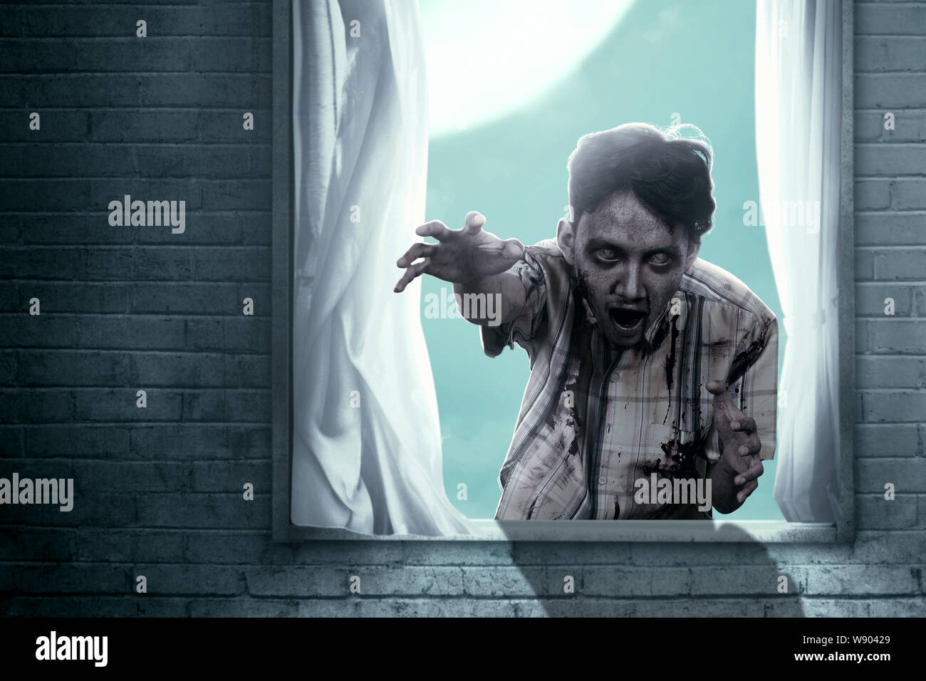 Scary zombies with blood and wound on his body haunted the abandoned