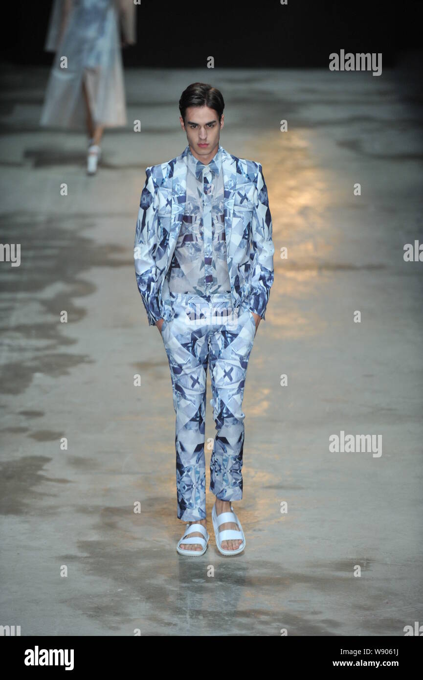 A model displays a new creation by designer Liu Sicong at the C ...