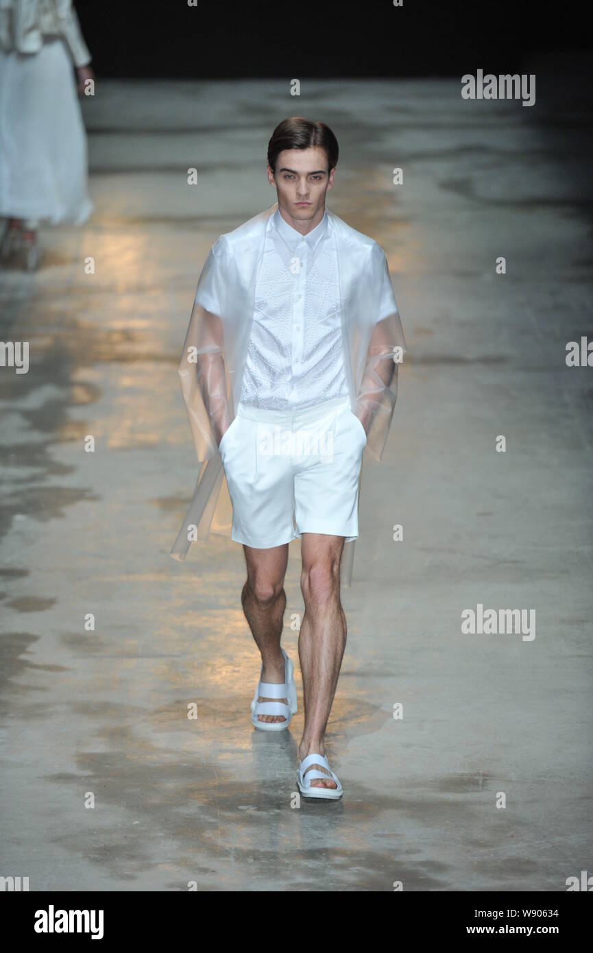 A model displays a new creation by designer Liu Sicong at the C ...