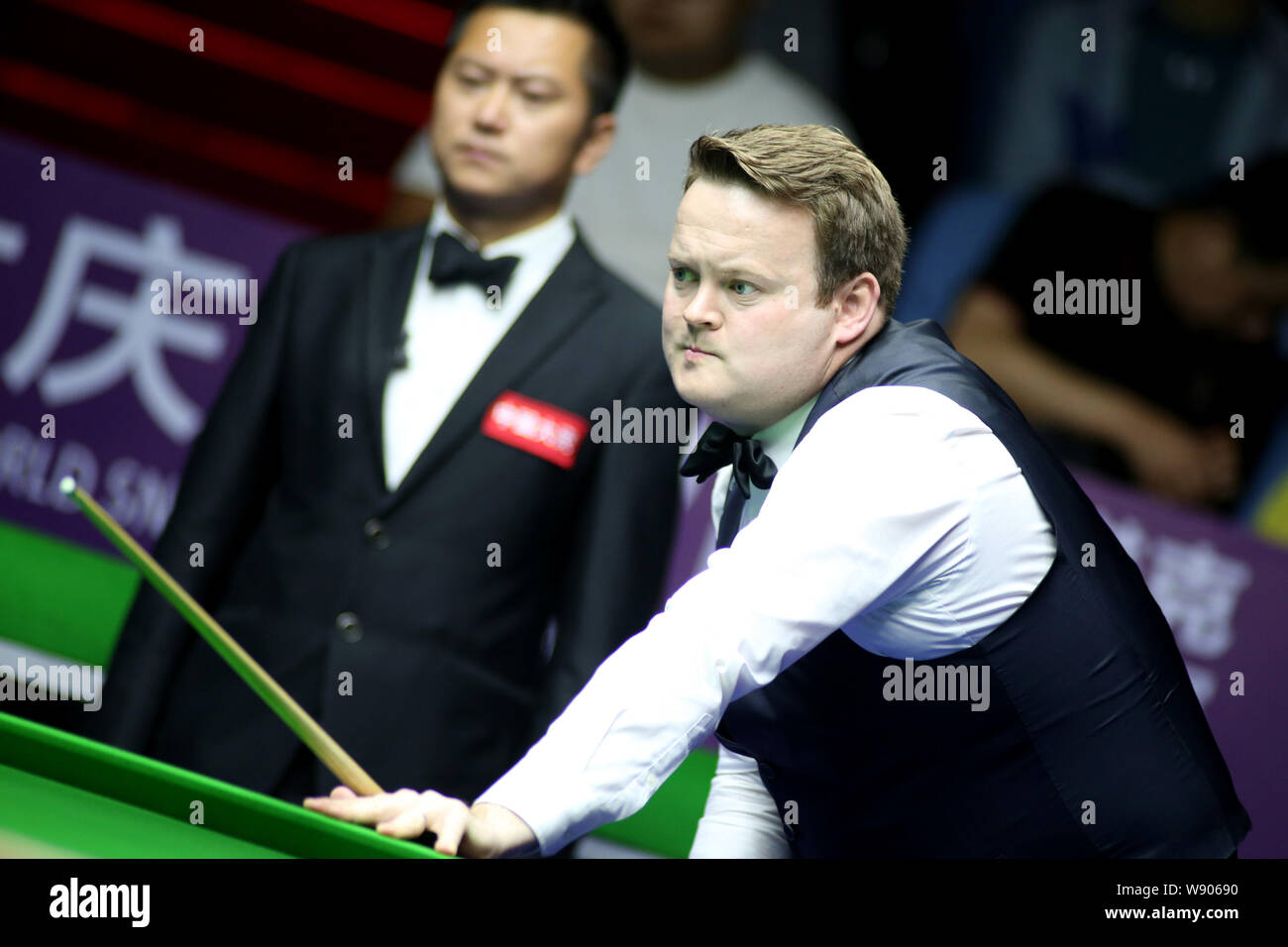 Shaun Murphy of England considers a shot to Mark Allen of Northern
