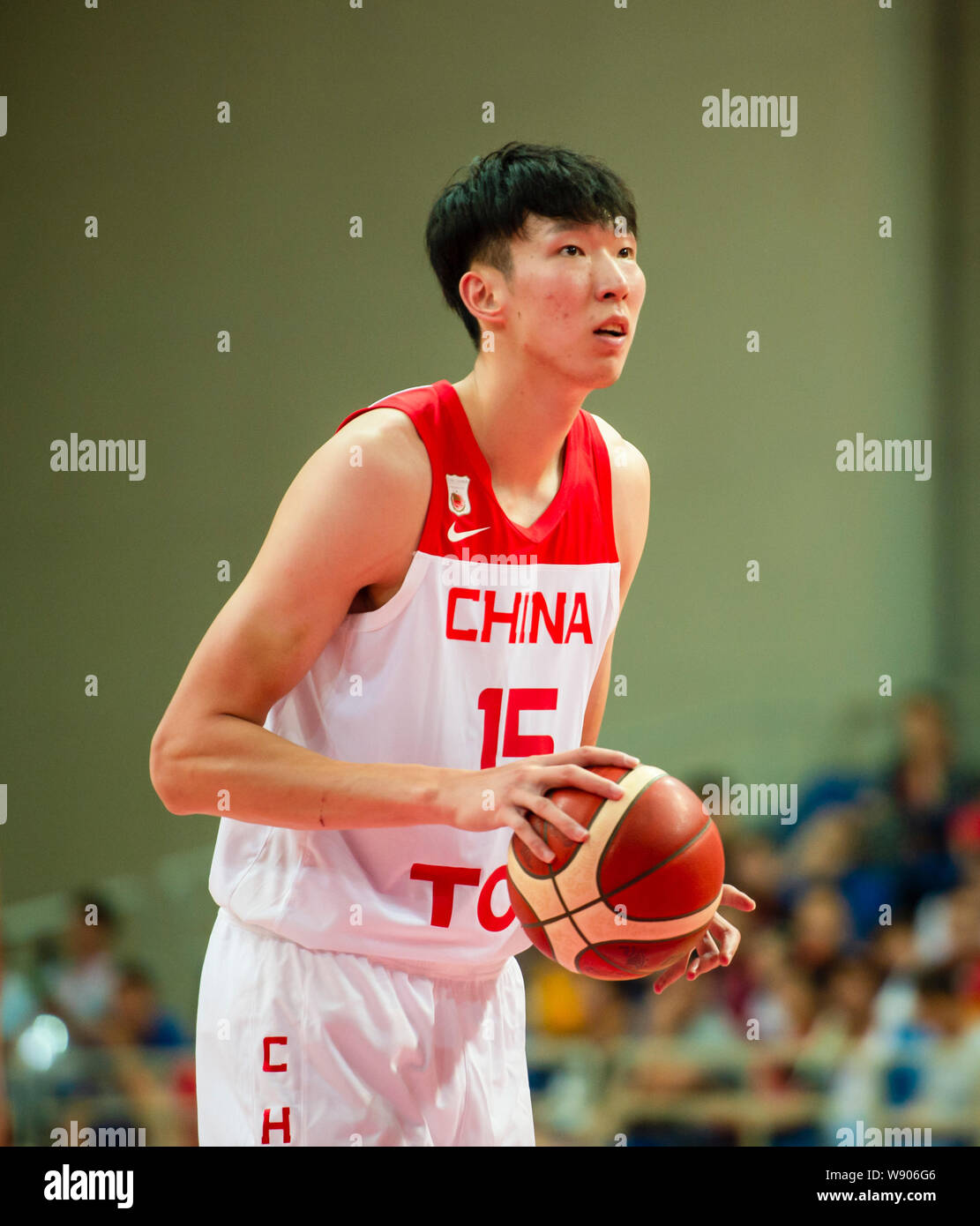 Zhou Qi, a professional  Chinese basketball player, shoots during 2019 Zhouzhuang Cup Kunshan Men’s International Basketball Championship against Croatia in Kunshan county-level city, Suzhou city, east China’s Jiangsu province, 11 August 2019.  China won the game against Croatia with 89-73 at 2019 Zhouzhuang Cup Kunshan Men’s International Basketball Championship in Kunshan county-level city, Suzhou city, east China’s Jiangsu province, 11 August 2019. Stock Photo