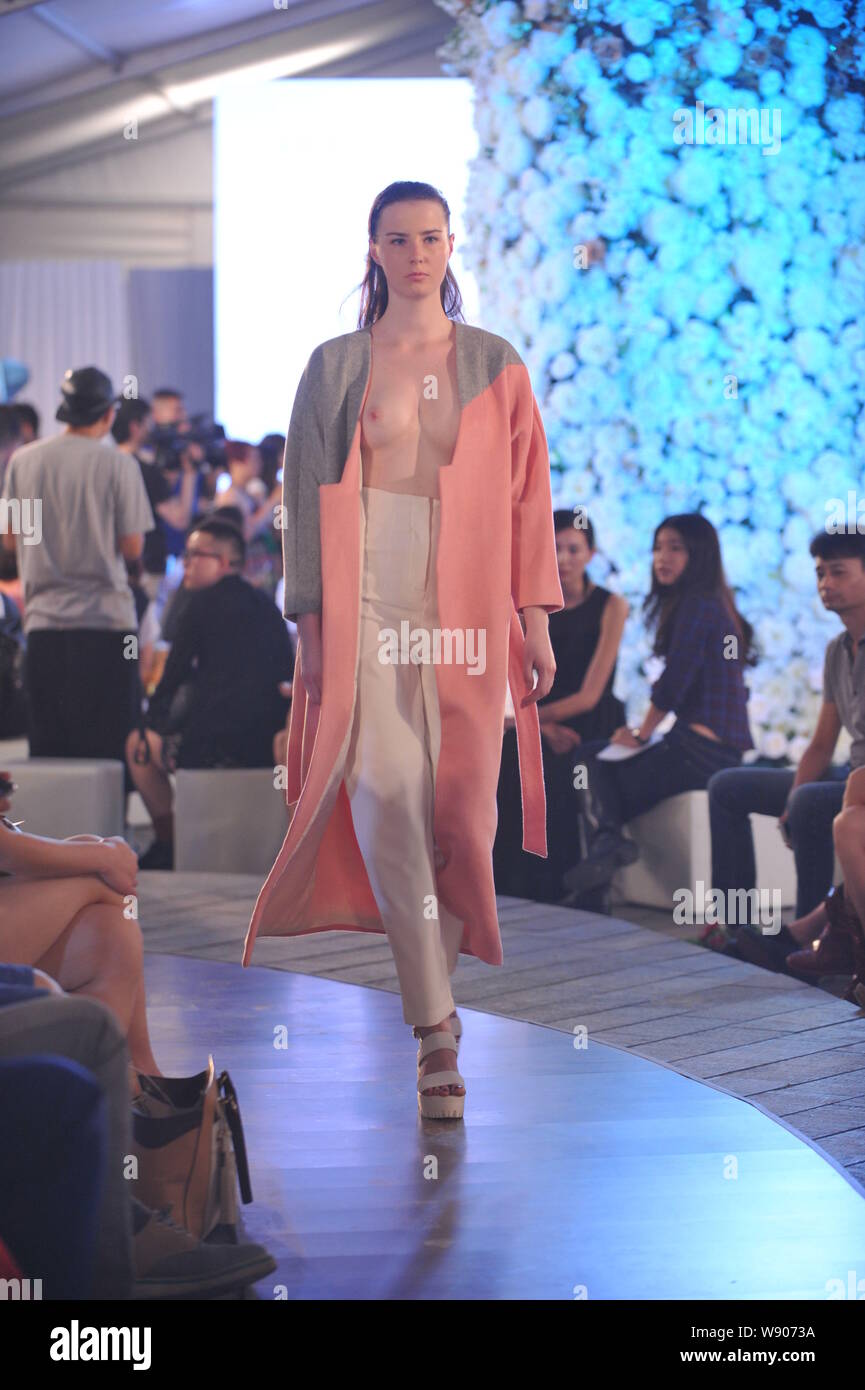 A model displays a new creation at the Alan & Cross fashion show during