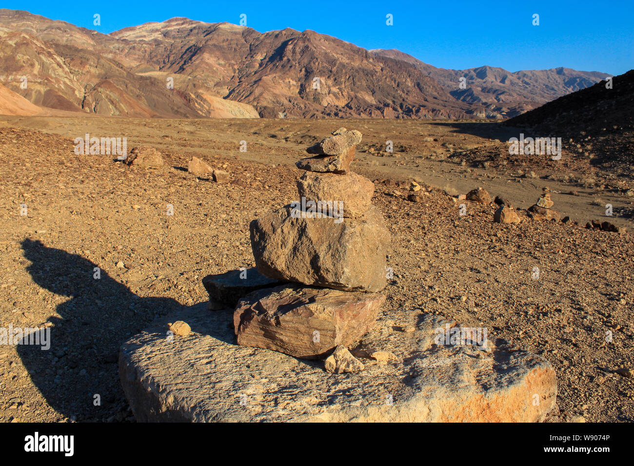 Mushroom Rocks In Death Valley Rocks stacked with background of desert landscape along the Artists ...