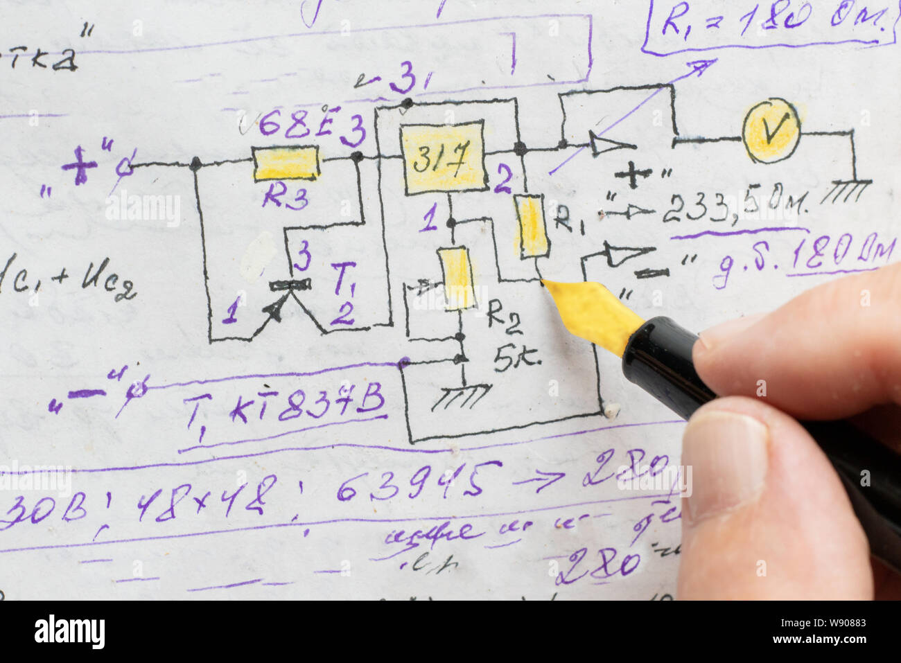 macro view of engineer planing the electrical circuit on paper Stock Photo