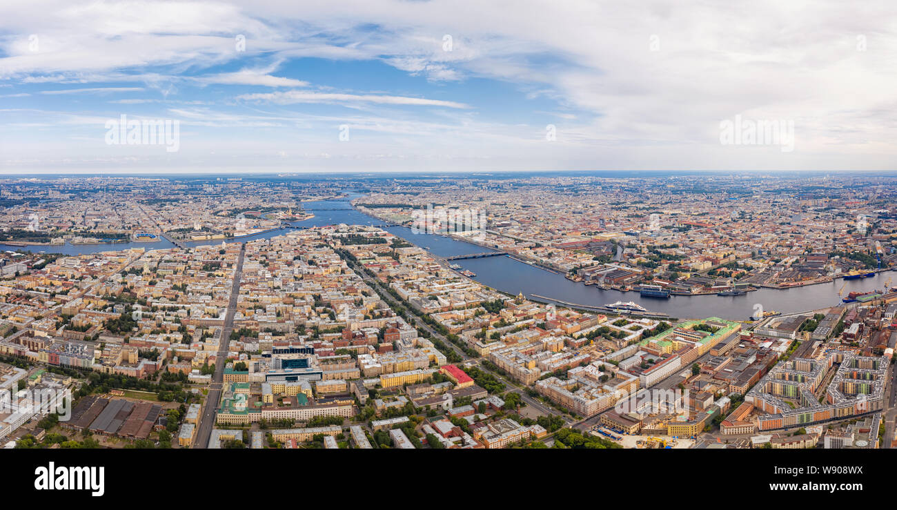 Aerial panoramic view of Neva river and historical center in Saint Petersburg, Russia. Large wide angle cityscape with dramatic cloudy sky Stock Photo