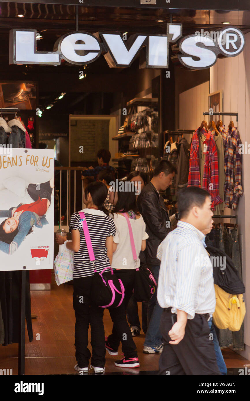 FILE--Customers shop at a store of Levis in Macau, China, 7 December 2011.  Levis, one of the worlds most famous jeans makers, has had a falling ou  Stock Photo - Alamy