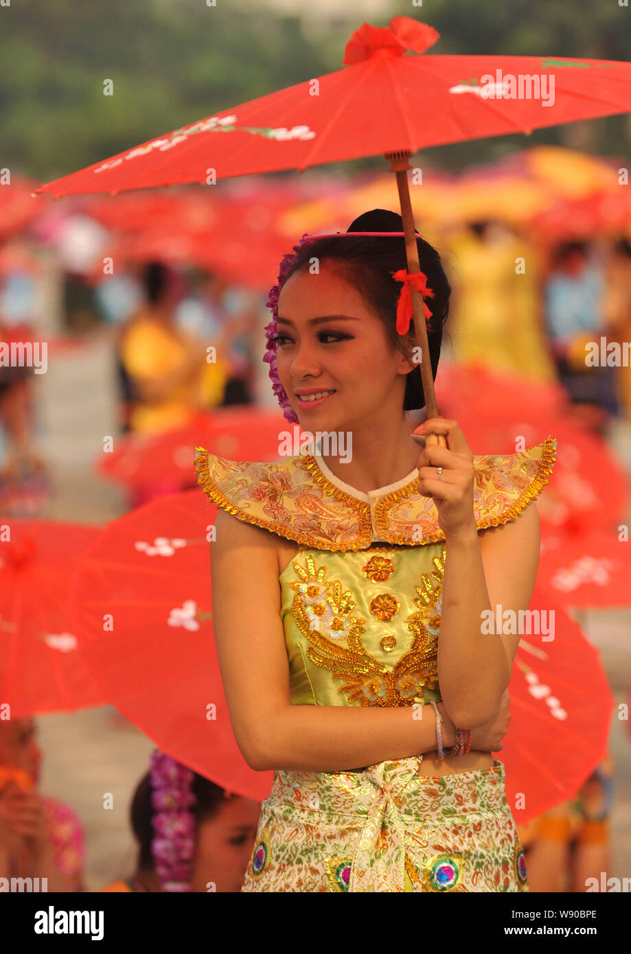 Chinese performers dressed in traditional costumes of Dai ethnic