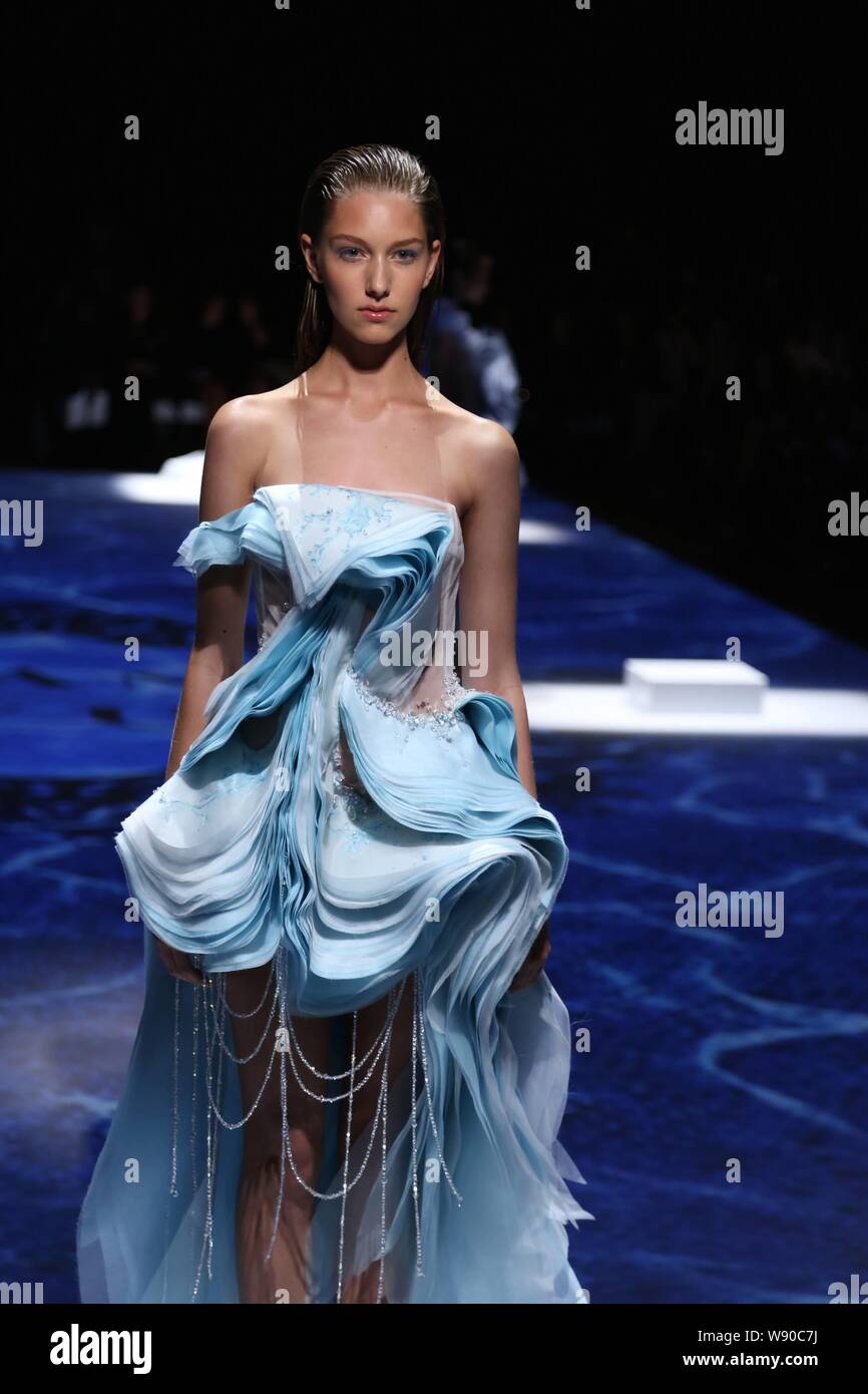 A model displays a new creation by Lan Yu at its Fall/Winter 2014 Haute ...