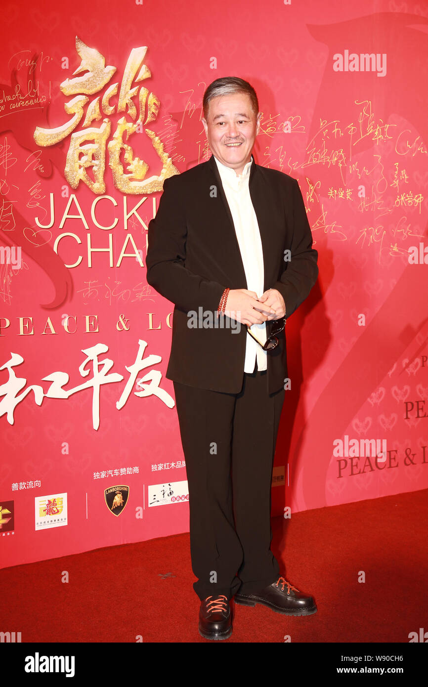 Chinese actor Zhao Benshan poses as he arrives for the Peace & Love