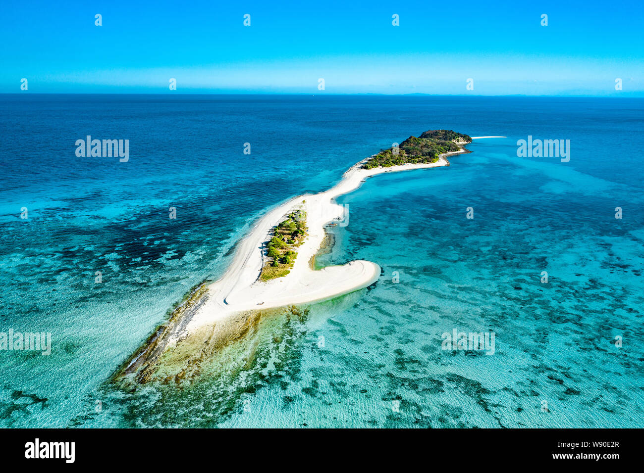 Truly amazing tropical island in the middle of the ocean. Aerial view of an island with white sand beaches and beautiful lagoons Stock Photo