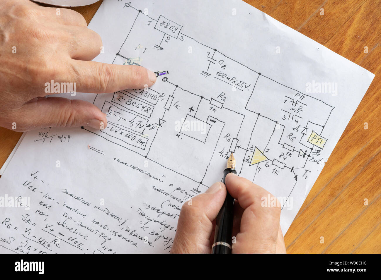 macro view of engineer planing the electrical circuit on paper Stock Photo