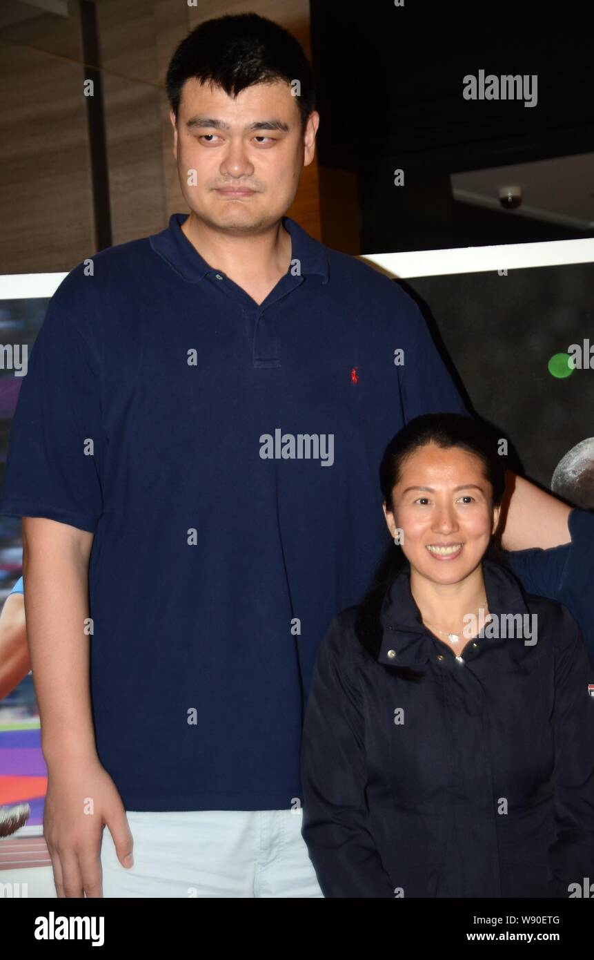 Retired Chinese basketball superstar Yao Ming, left, and Olympic speed-skating champion Yang Yang pose at a sports photo exhibition organized by Pulit Stock Photo