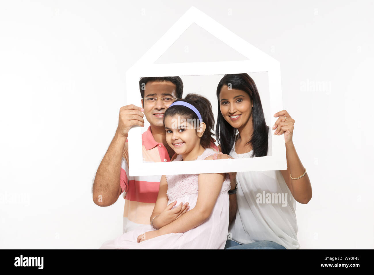 Family holding frame hires stock photography