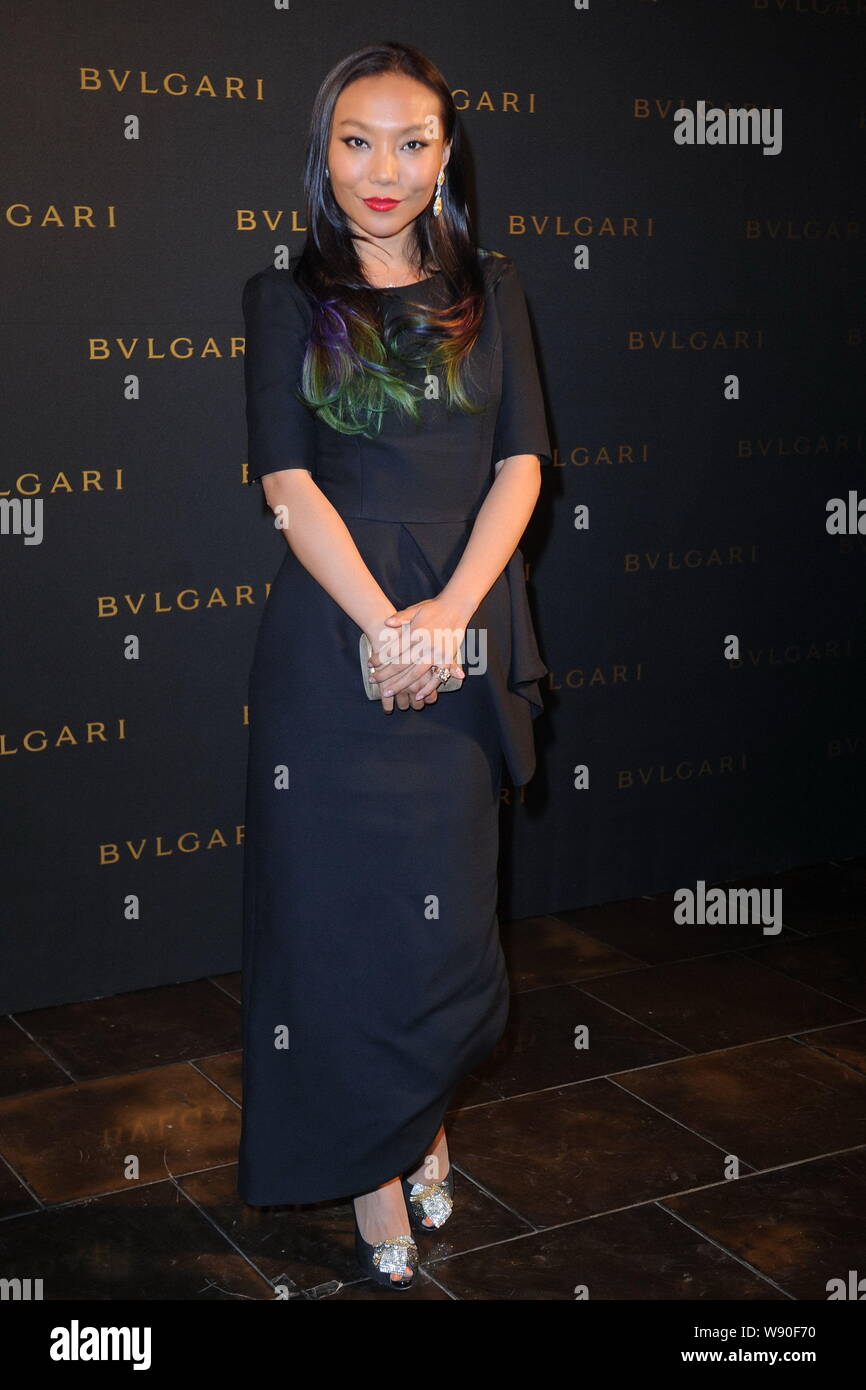 Chinese jewellery designer Wan Baobao, granddaughter of former Chinese Vice Premier Wan Li, poses as she arrives at the Bulgari DIVA jewelry show in B Stock Photo