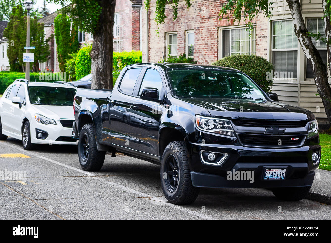 A black Chevrolet Silverado Z71 parked in a road in Madison Park, Seattle Stock Photo