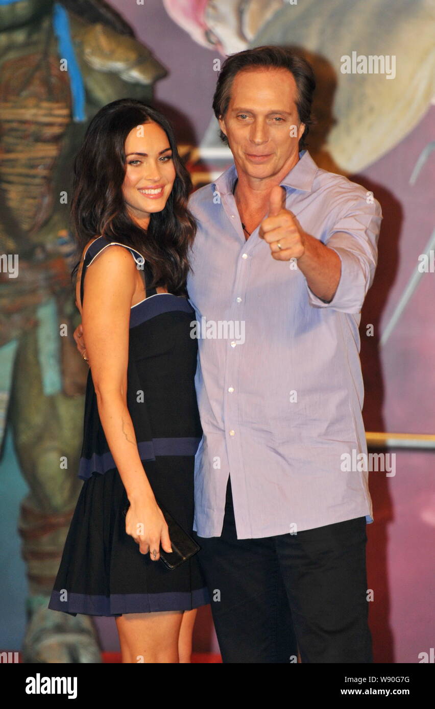 American actress Megan Fox, left, and actor William Fichtner pose during a press conference for their new movie 'Teenage Mutant Ninja Turtles' in Beij Stock Photo
