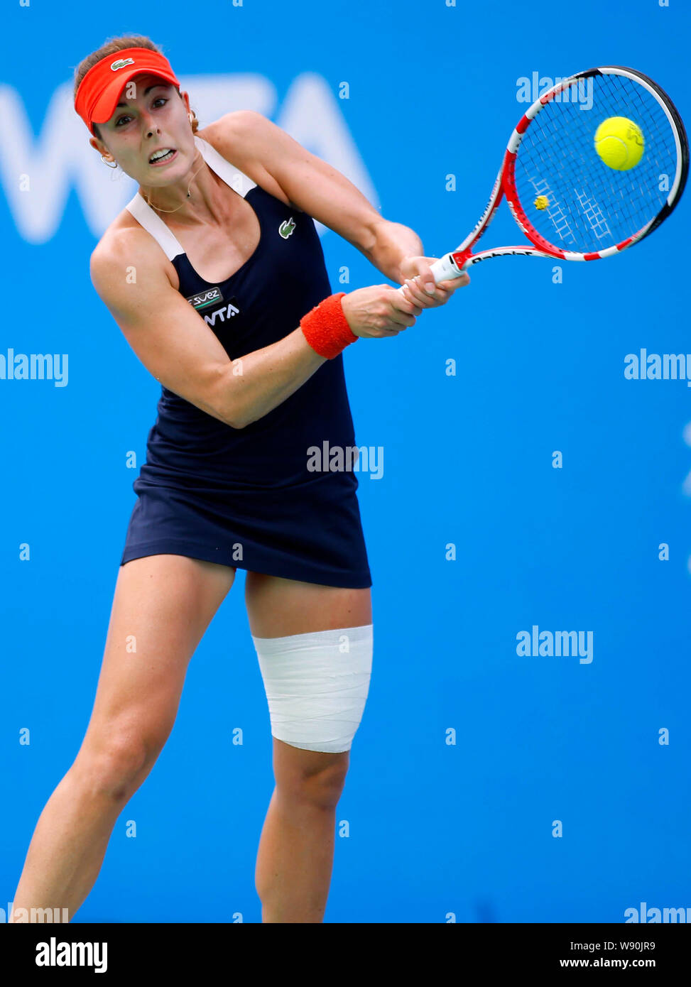Alize of France prepares to return a shot to Eugenie Bouchard of
