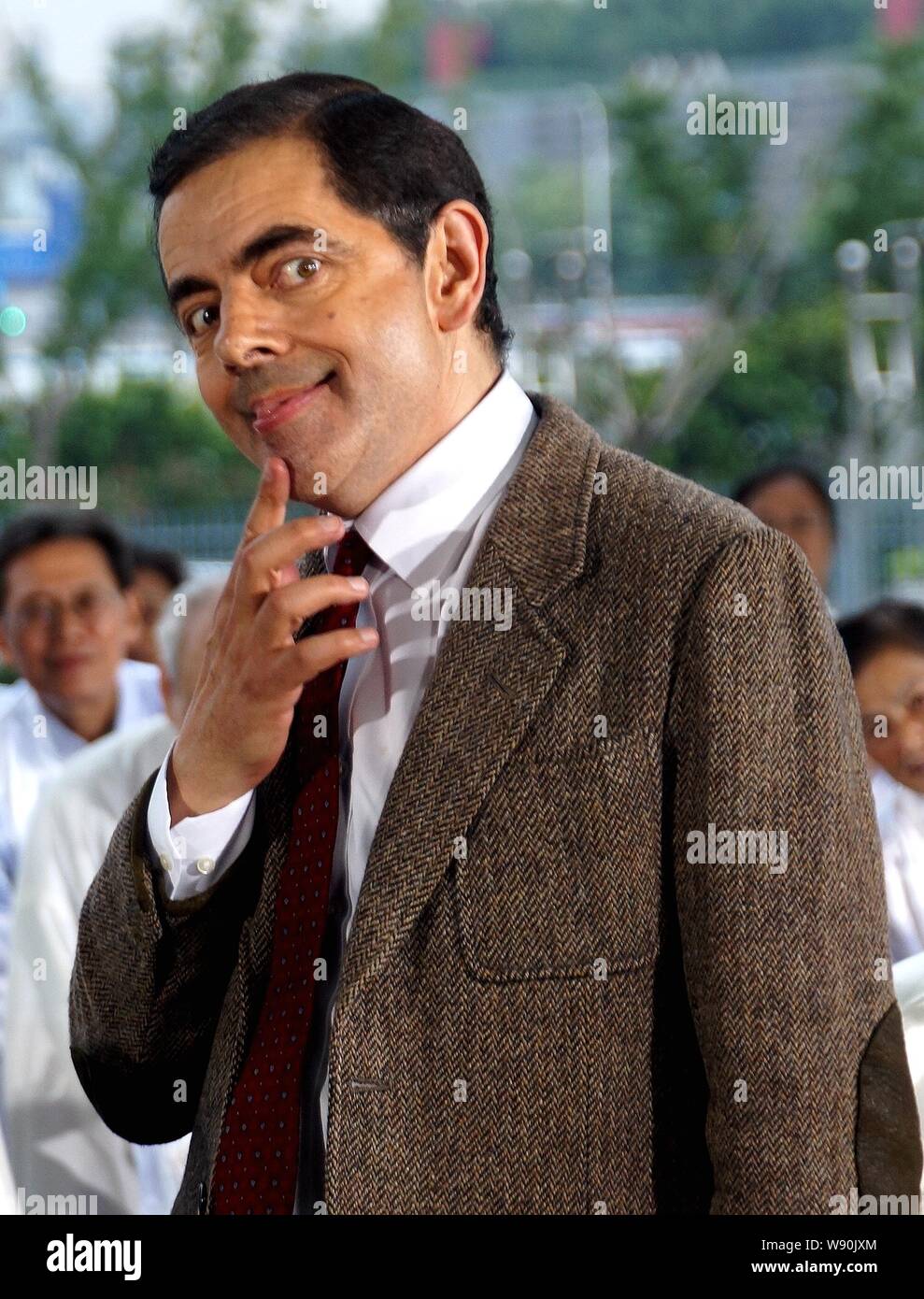 English actor Rowan Atkinson plays Mr. Bean during a filming session for a TV commercial at the Mercedes-Benz Arena in Shanghai, China, 20 August 2014 Stock Photo