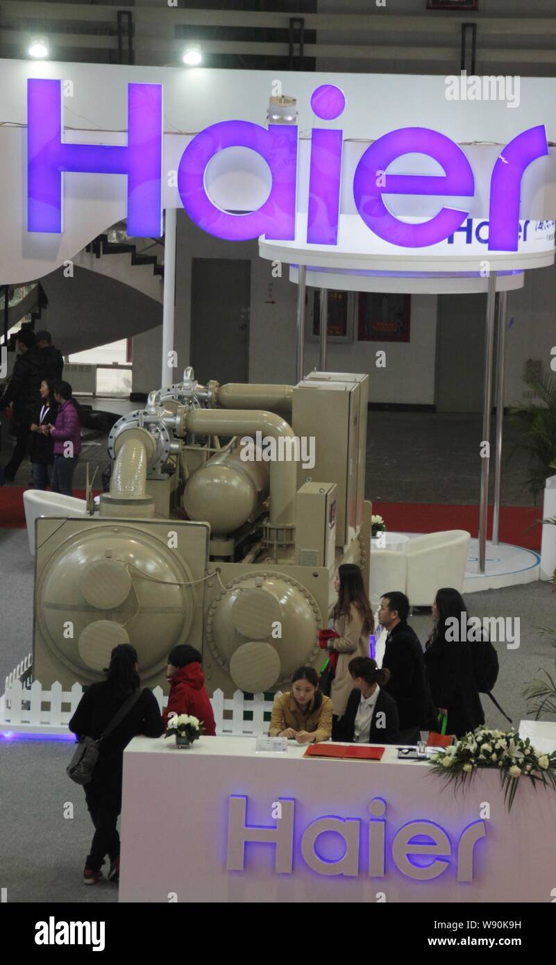 People visit the stand of Haier during the 2014 International Trade Fair for Energy Conservation and Environmental Protection, also known as EnerCon C Stock Photo