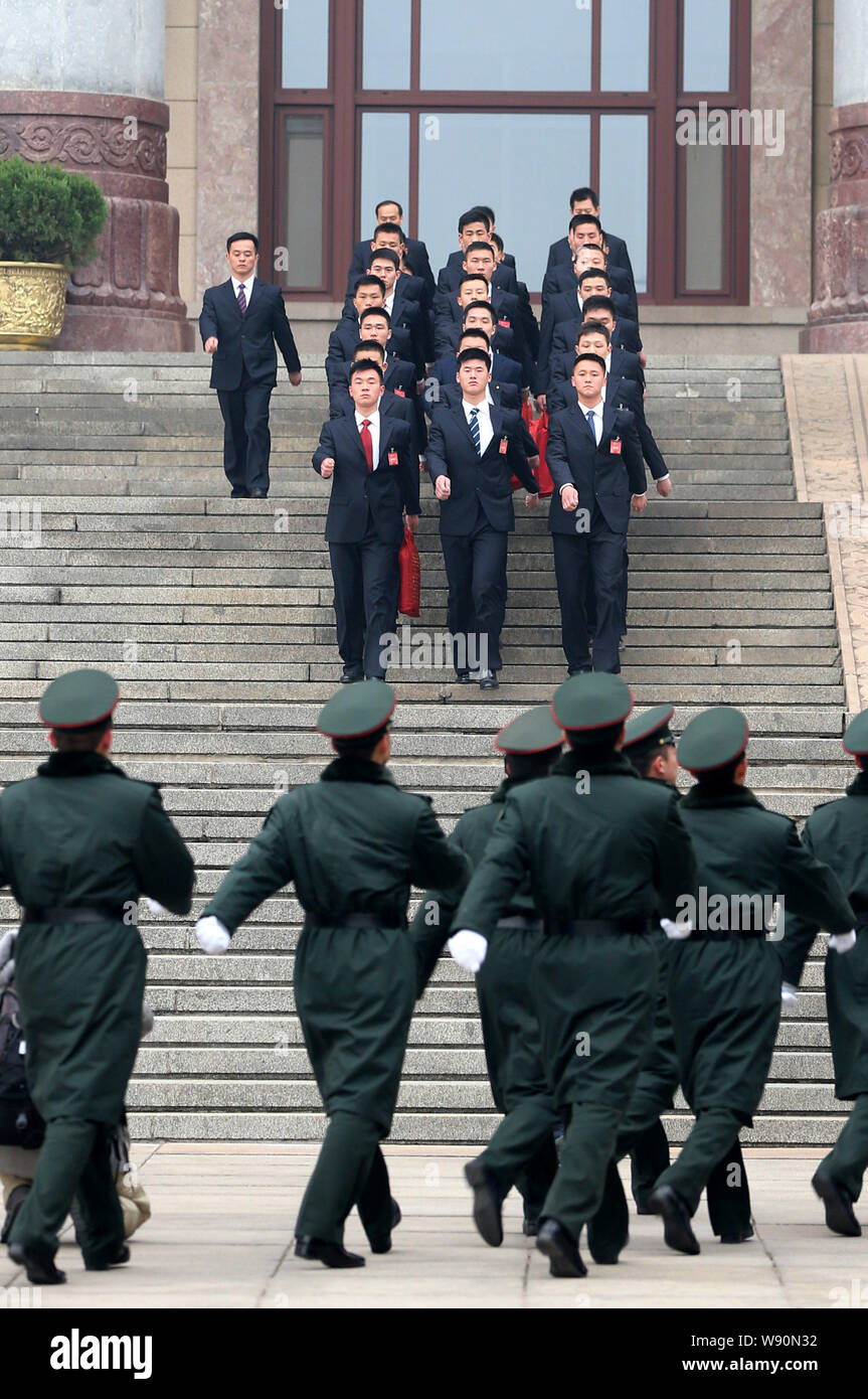 Chinese paramilitary policemen and security guards patrol the Great Hall of the People in Beijing, China, 3 March 2014.   Beijing has stepped up secur Stock Photo