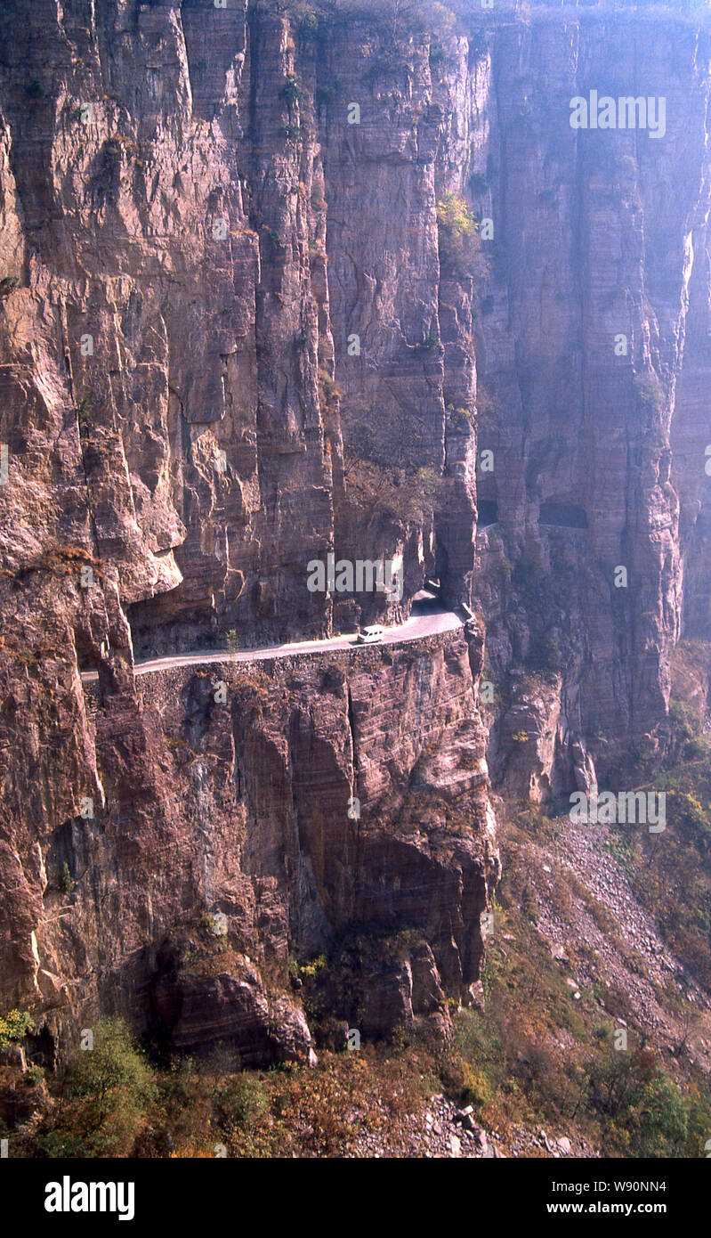 --FILE--A minivan travels along the Guoliang Tunnel through the Wanxian Mountain in the Taihang Mountains in Huixian county, Xinxiang city, central Ch Stock Photo