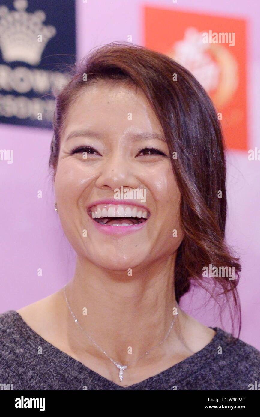 --FILE--Chinese tennis star Li Na laughs during a press conference for her new book in Beijing, China, 22 February 2014.   China's two-time Grand Slam Stock Photo