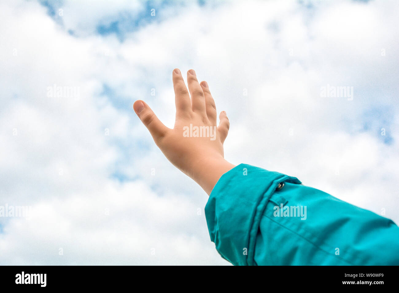 Childrens Hands Reaching Up