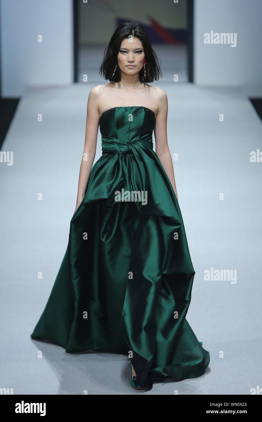 A model displays a new creation by designer Wang Yutao at the Beauty ...