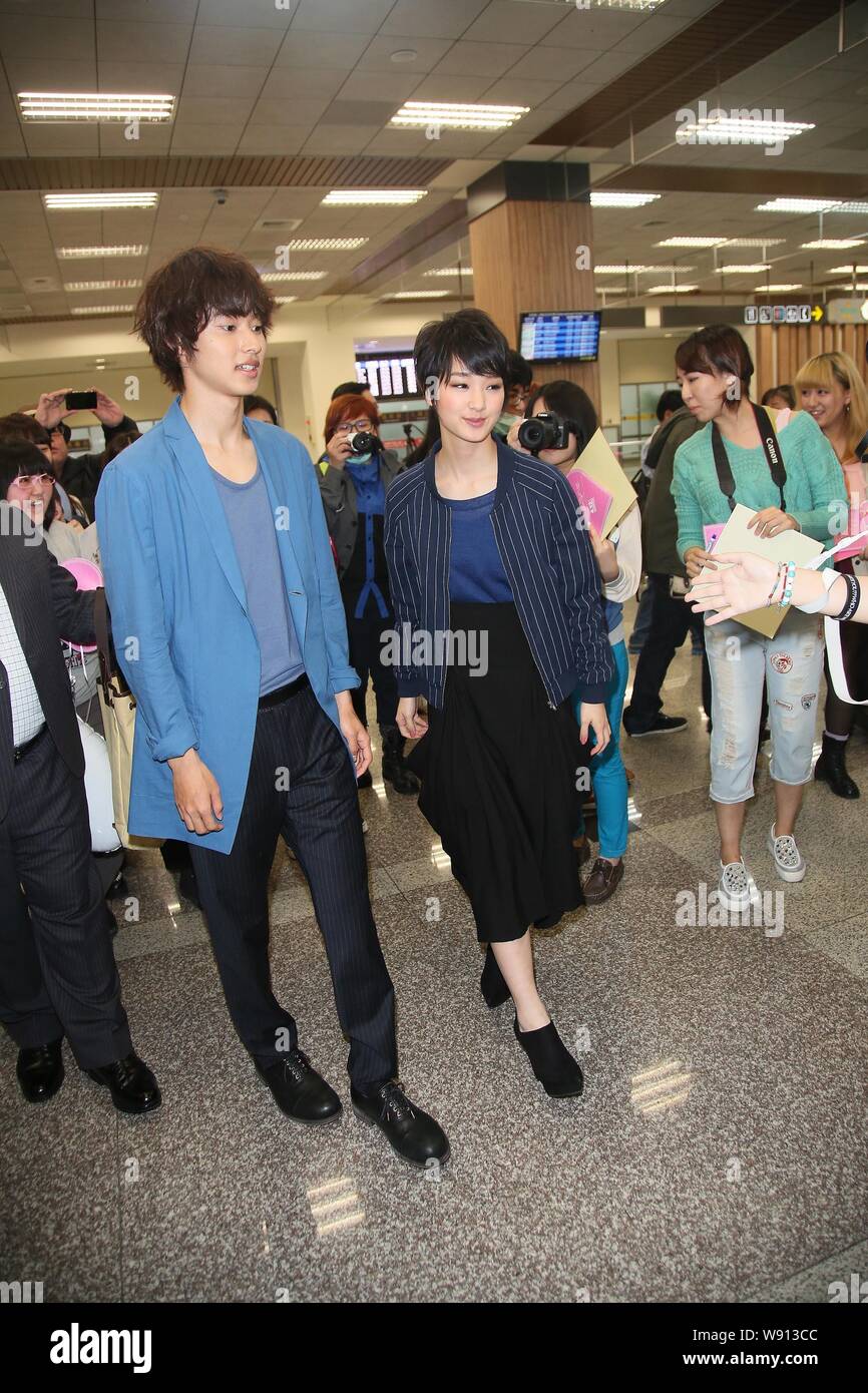 Japanese actress Ayame Goriki, front right, and actor Kento Yamazaki, front left, walk towards the exit at the Taiwan Taoyuan International Airport af Stock Photo