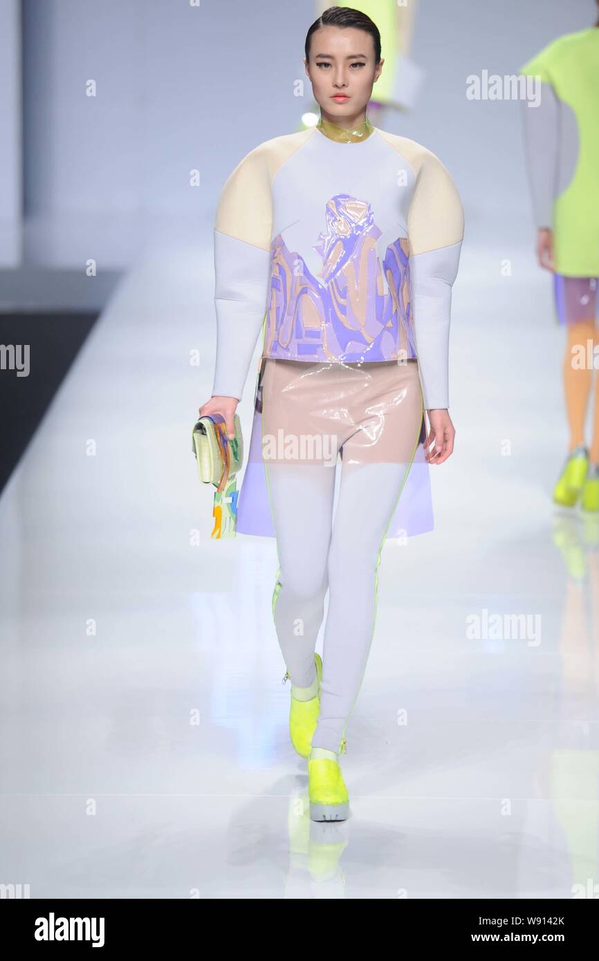 A model displays a new creation at the We Up Fashion show jointly